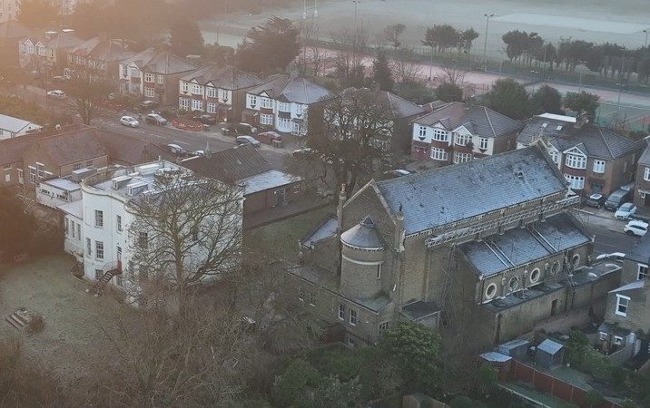 Aerial view of the church and Highcombe House from the north-west